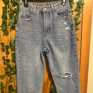 Distressed jeans. Never worn.